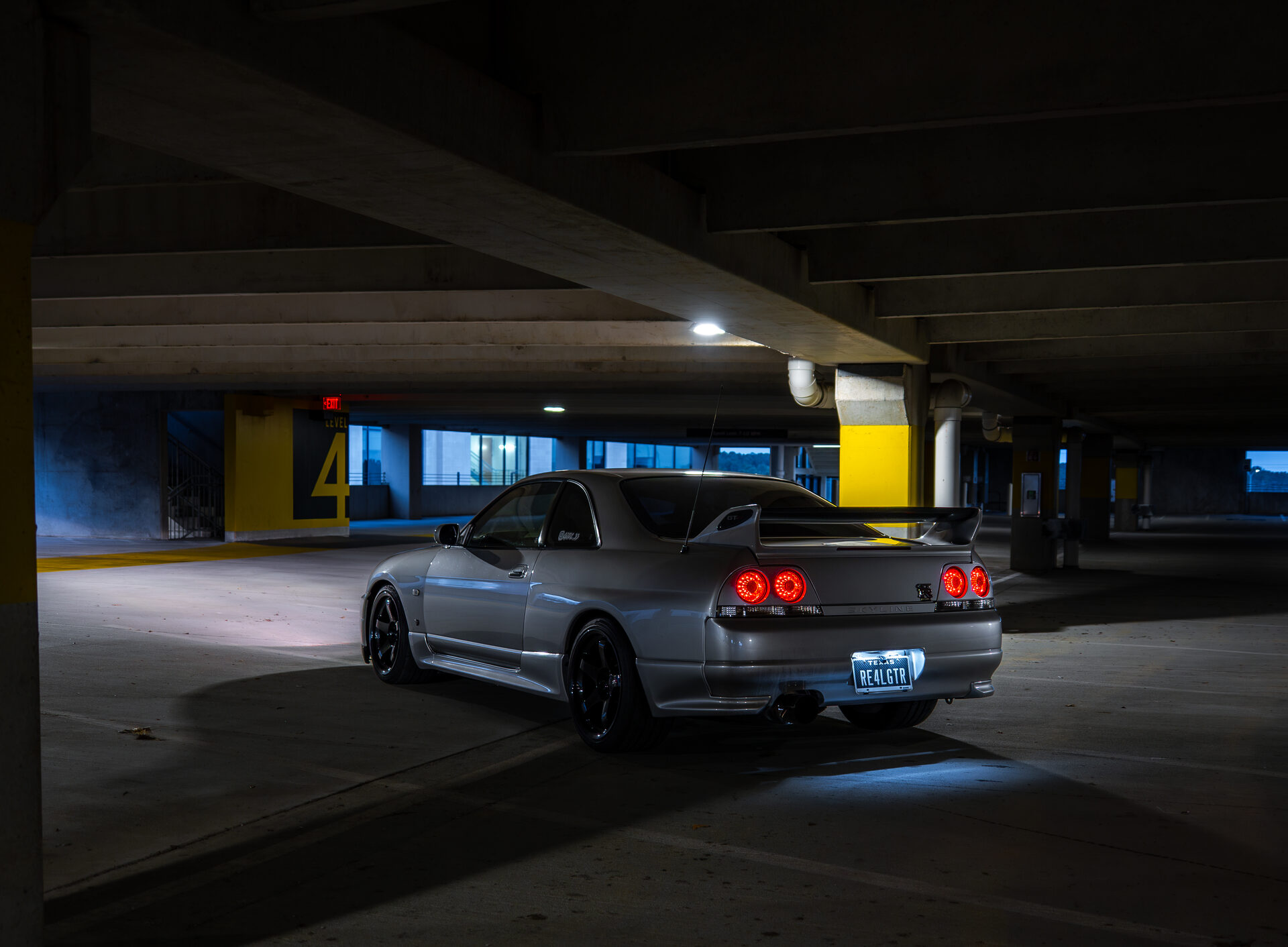 Silver car at sunset wide