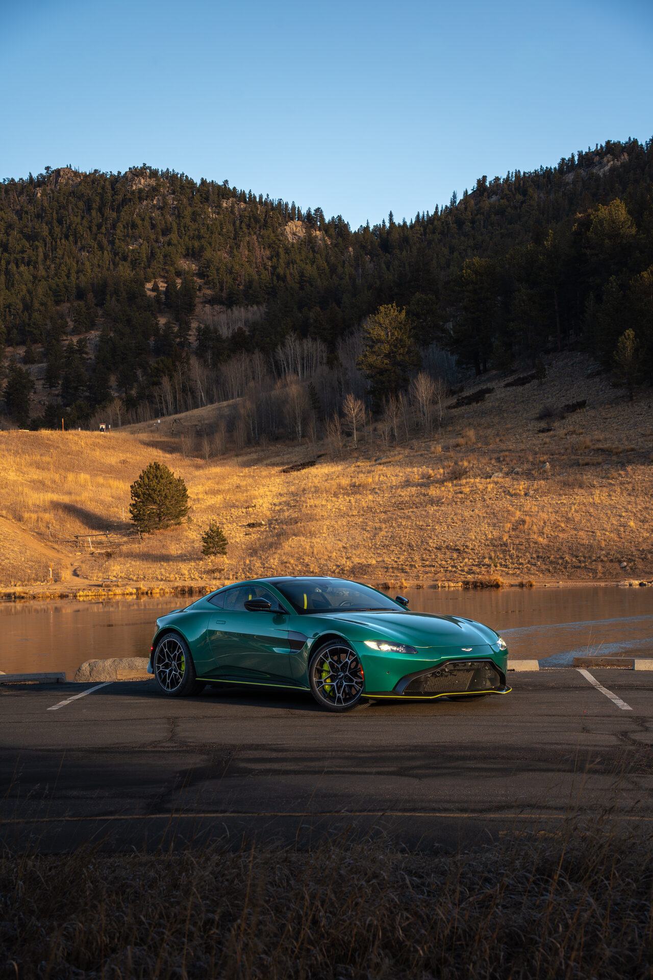 Green Aston Martin mountain road
