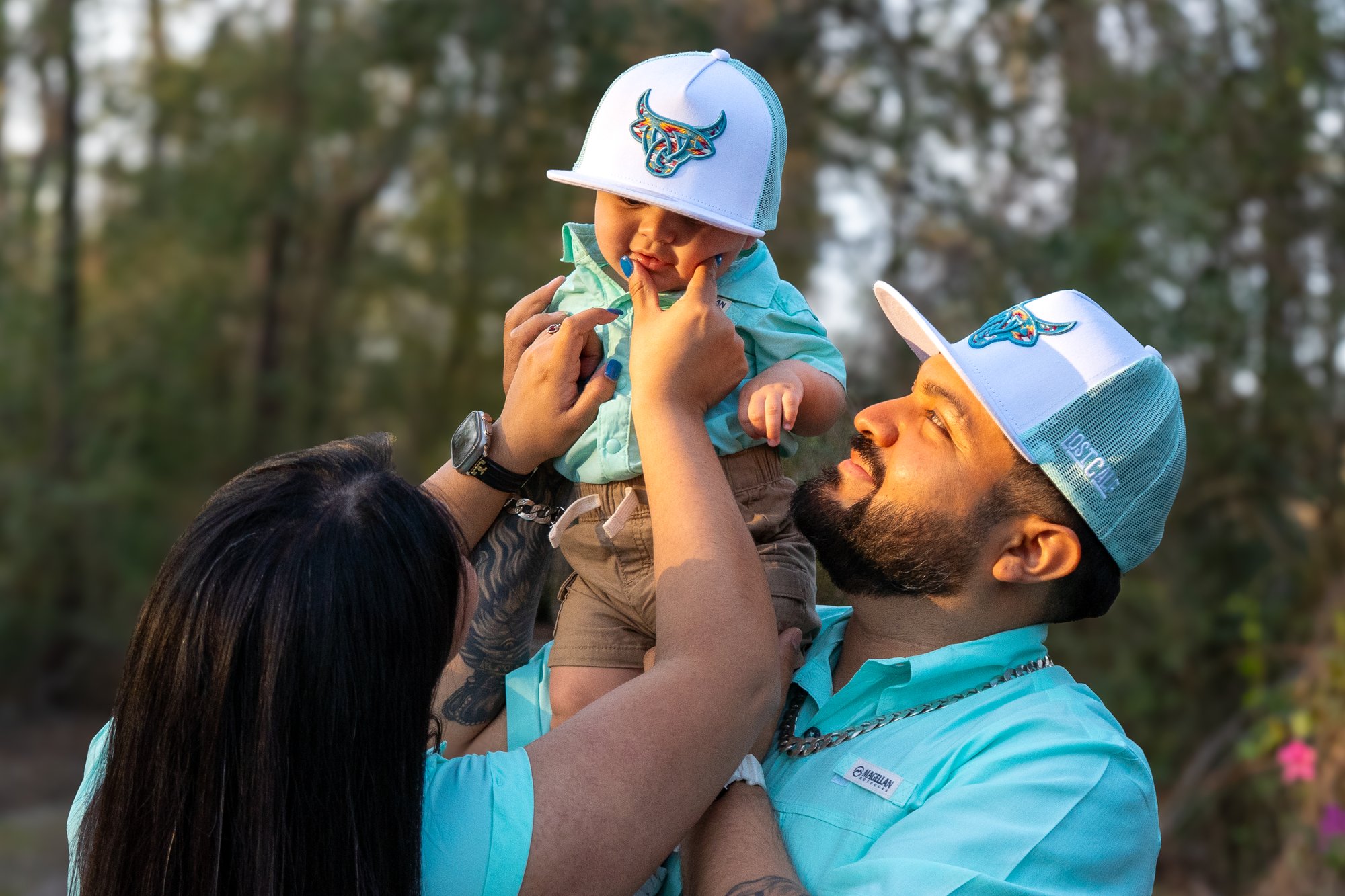 Family of three at golden hour sunset