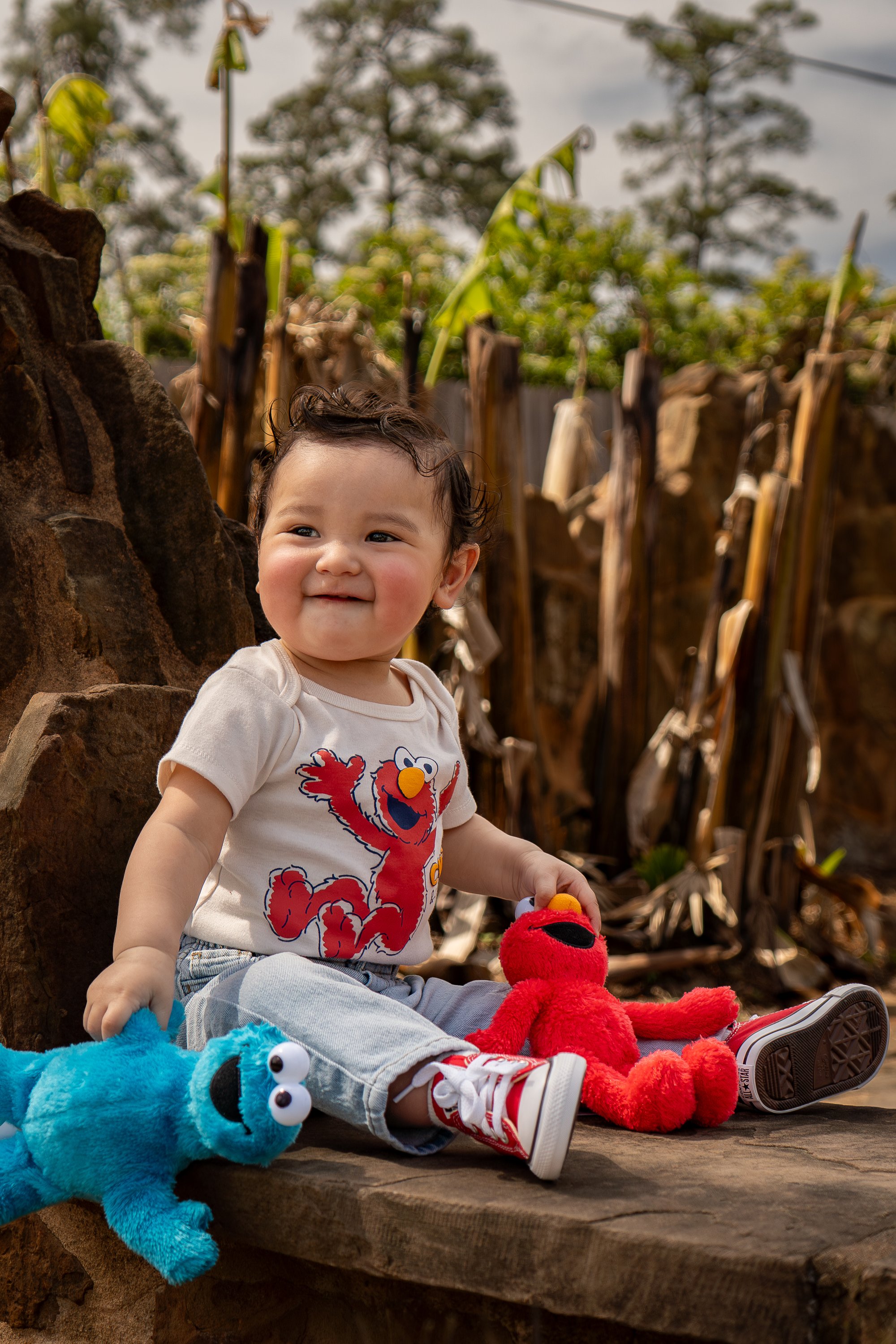 Baby portrait sitting with toys
